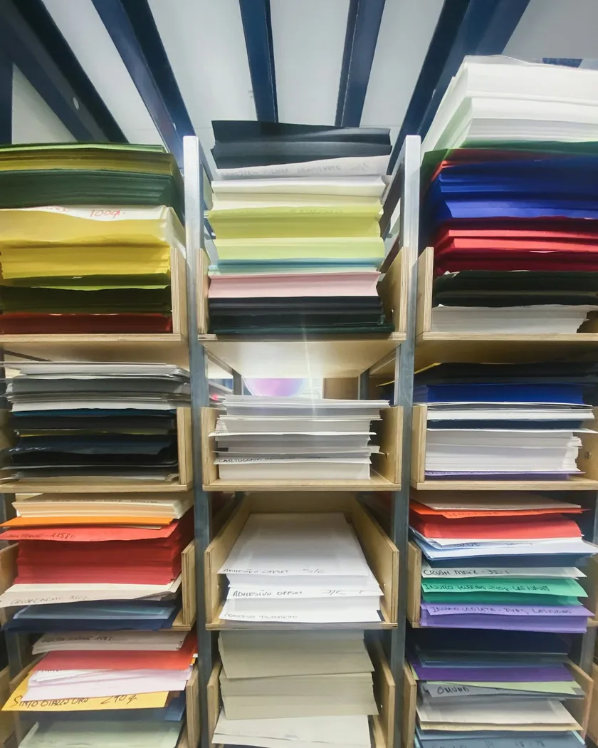 Stacks of coloured paper in a print shop