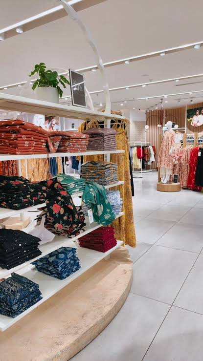 Inside a bright clothing boutique