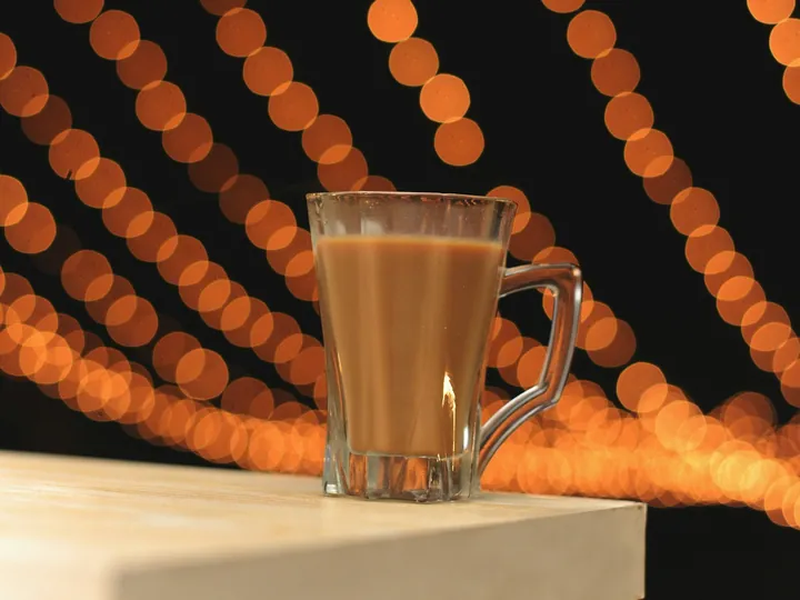 A glass of chai on a table